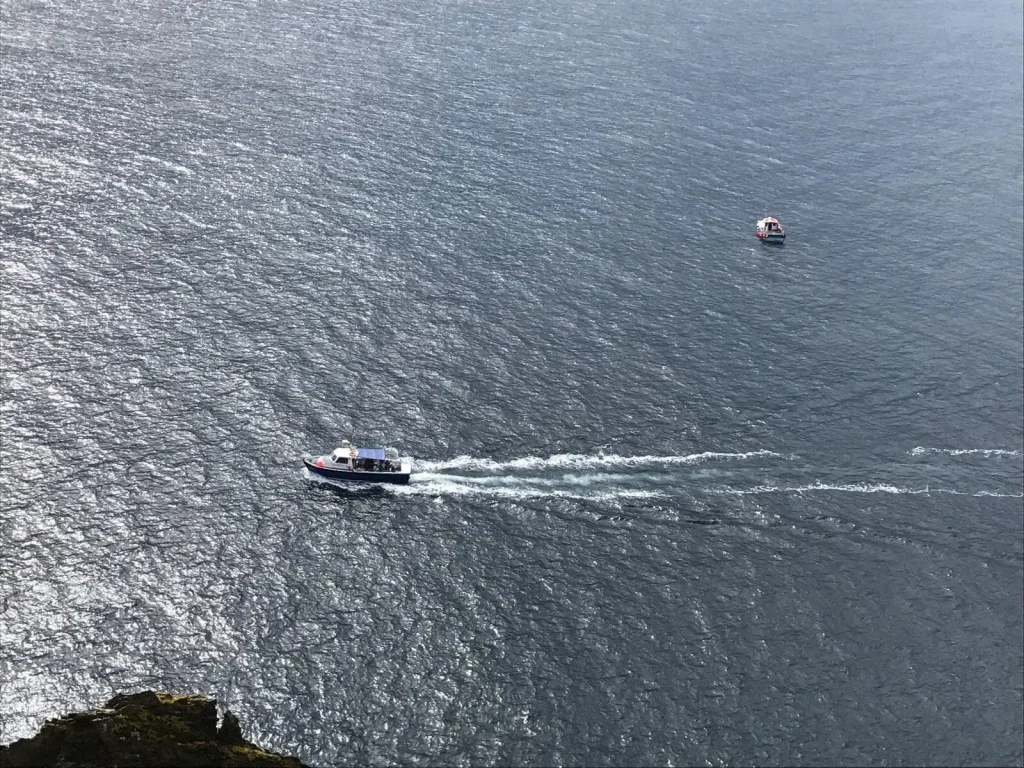 How to Get to Skellig Michael Boat approaching Skellig Michael on a calm sea